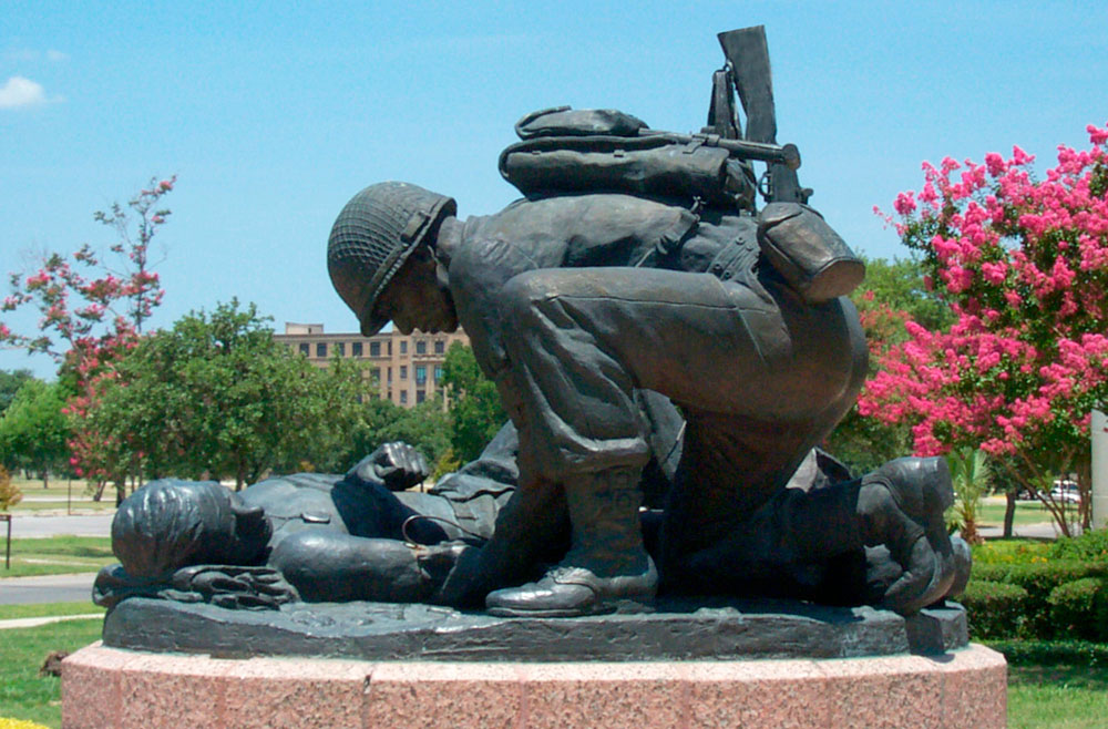 Statue of Soldier helping another person outside the front of the US Army Medical Museum.